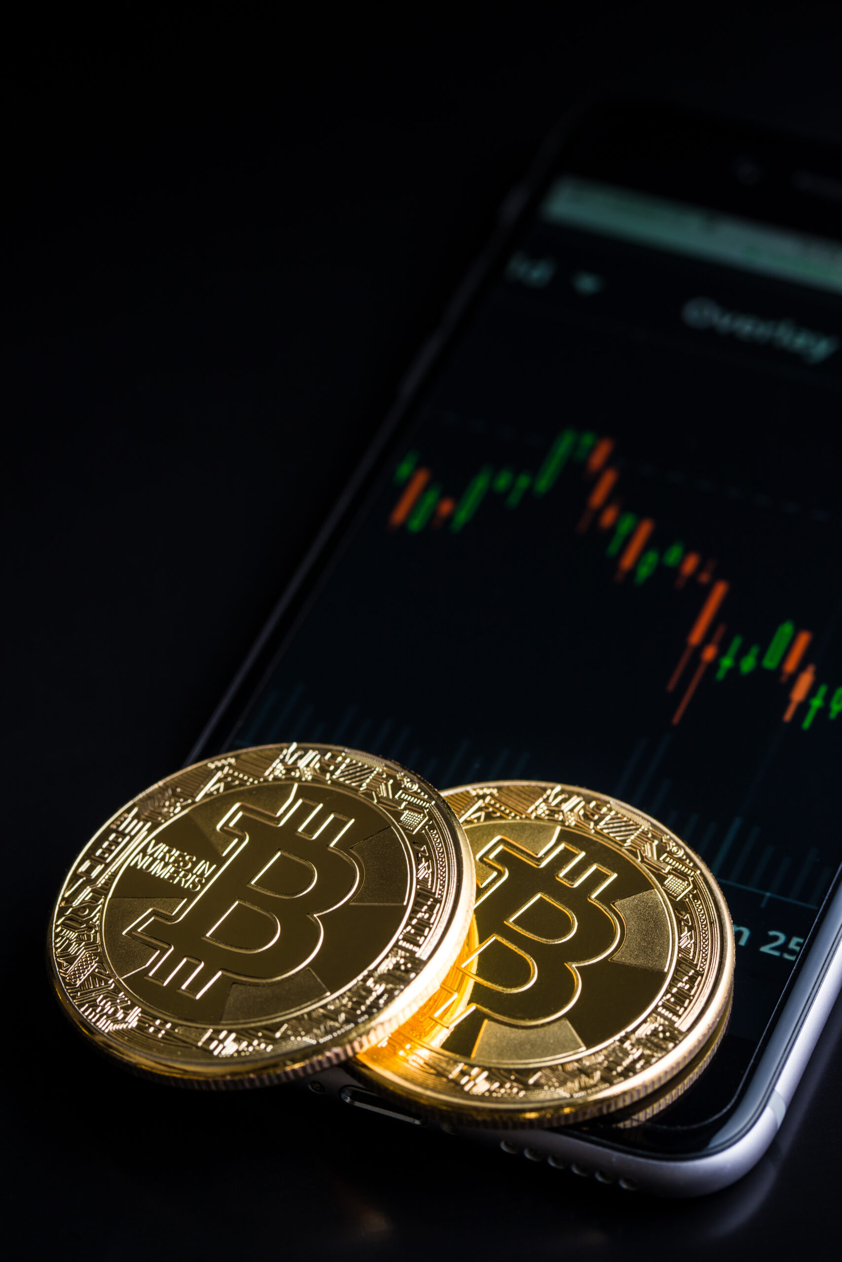 Concept with bitcoins and candle graph.